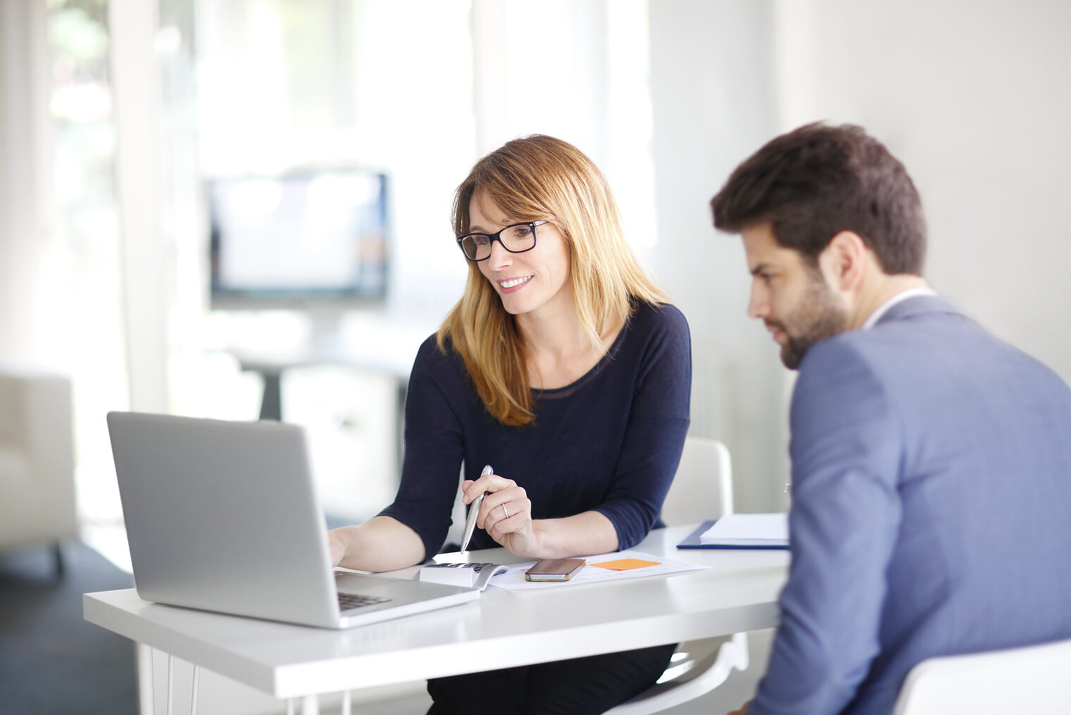 Portrait of investment advisor businesswoman sitting at office in front of computer and consulting with young professional man. Schlagwort(e): portrait, business, businesswoman, businessman, business people, person, working, laptop, client, financial, consultant, advisor, financier, professional occupation, computer, laptop, insurance, sales, tax, investment, office, desk, consulting, bank, middle aged, young, man, men, woman, women, 20s, 50s, ceo, assistant, administrator, office worker, looking, broker, confident, executive, money, saving, credit, planning, consultant, graph, data, portrait, business, businesswoman, businessman, business people, person, working, laptop, client, financial, consultant, advisor, financier, professional occupation, computer, insurance, sales, tax, investment, office, desk, consulting, bank, middle aged, young, man, men, woman, women, 20s, 50s, ceo, assistant, administrator, office worker, looking, broker, confident, executive, money, saving, credit, planning, graph, data